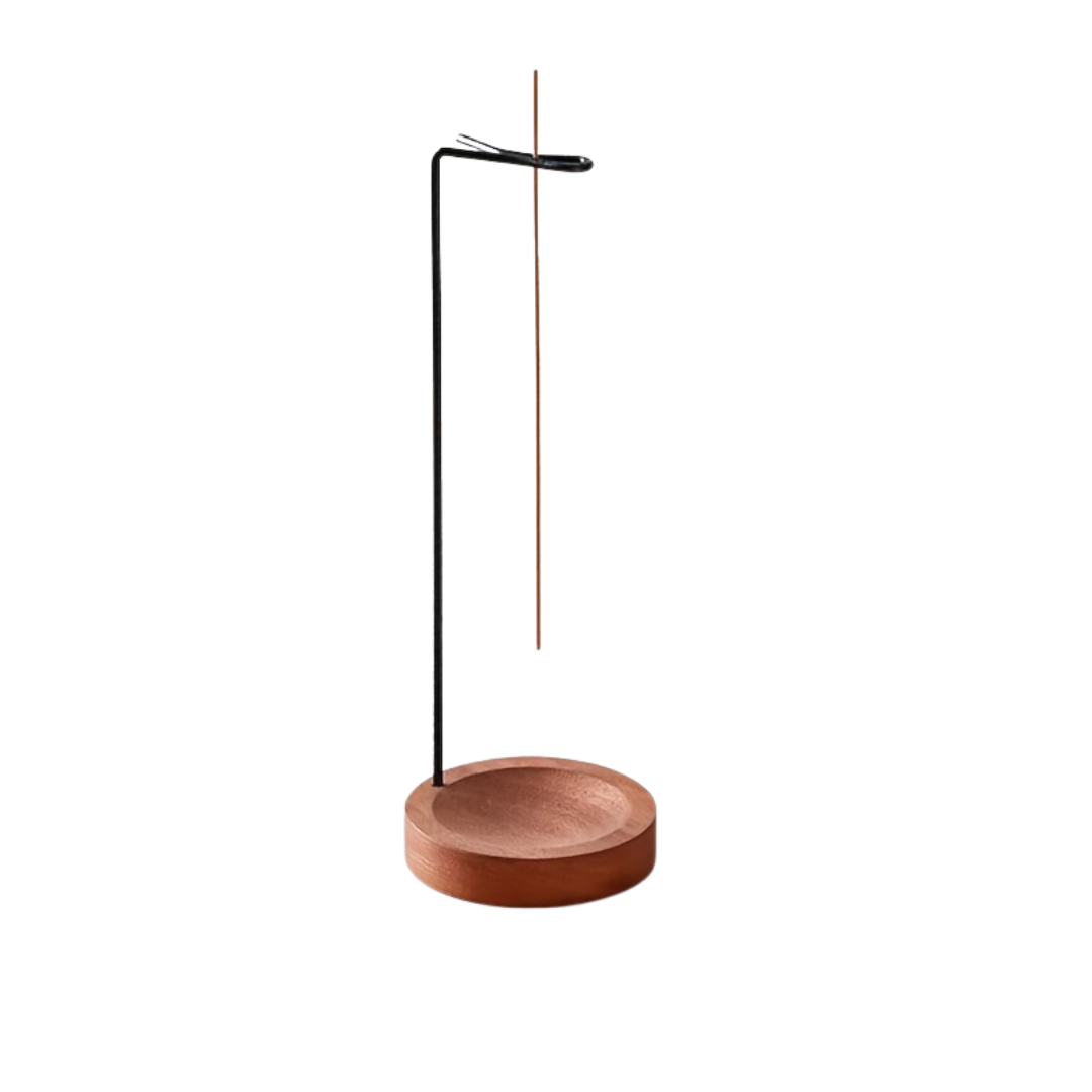 Wooden incense holder with a single incense stick on a white background