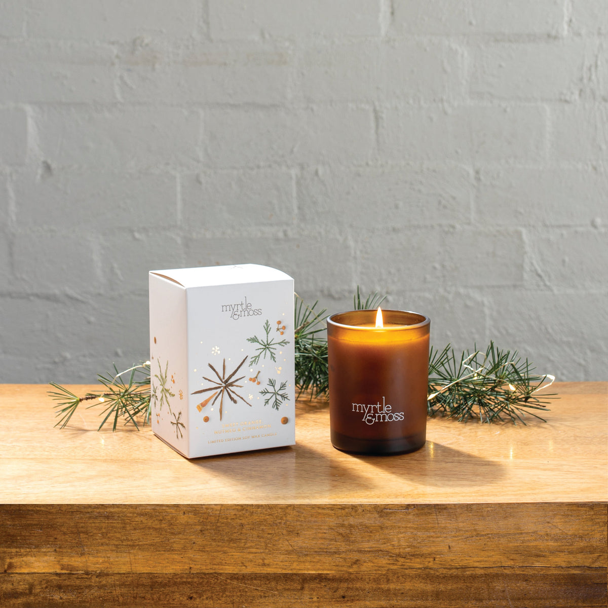 Myrtle & Moss Christmas Candle Sweet Orange, Nutmeg & Cinnamon 50 Hours - product and Christmas packaging