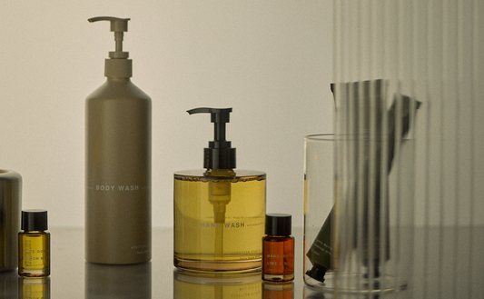 Addition Studio Mandarin Lime and Basil essential oil bottle featured on original brand countertop lifestyle photograph