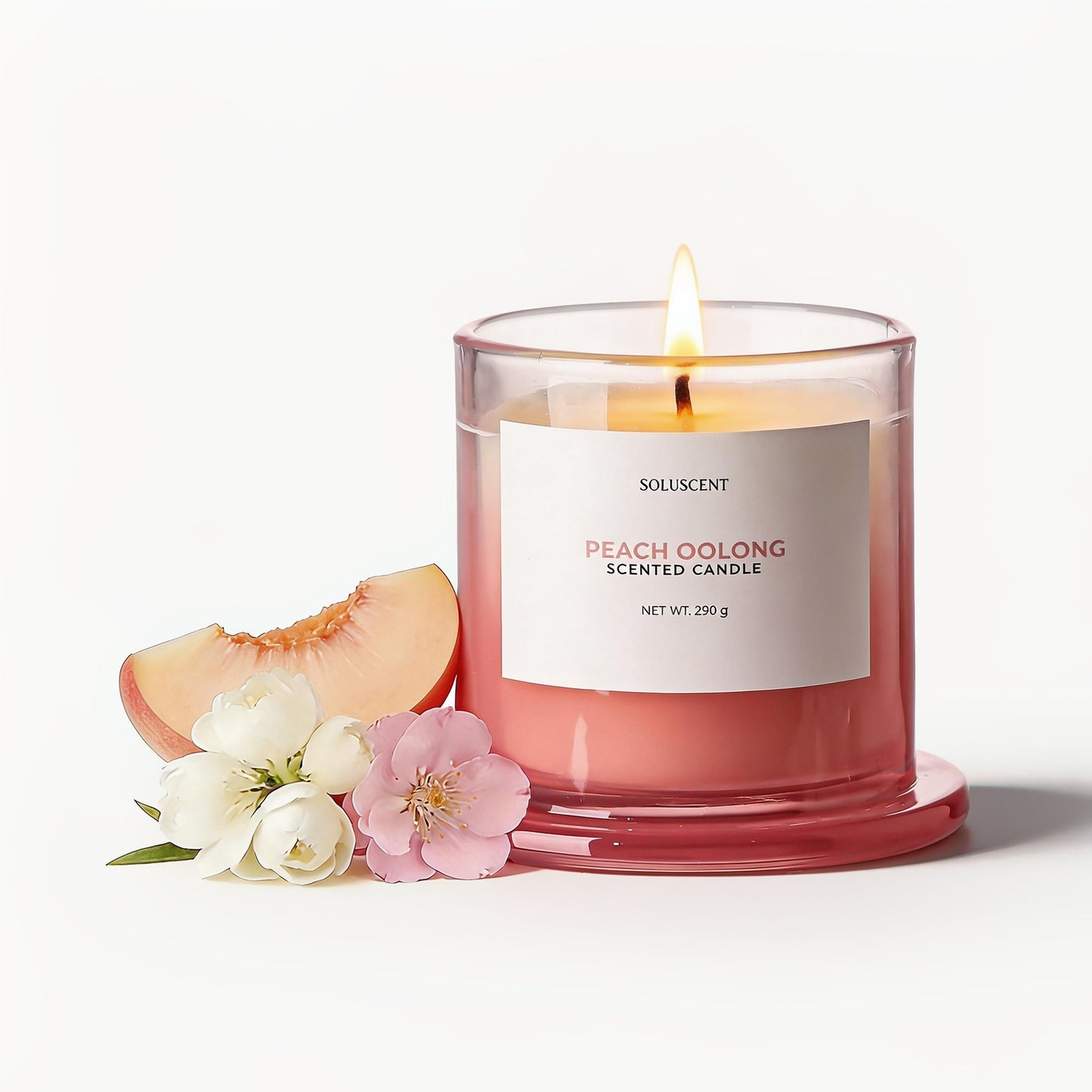 Soluscent Peach Oolong candle styled with peach and blossom