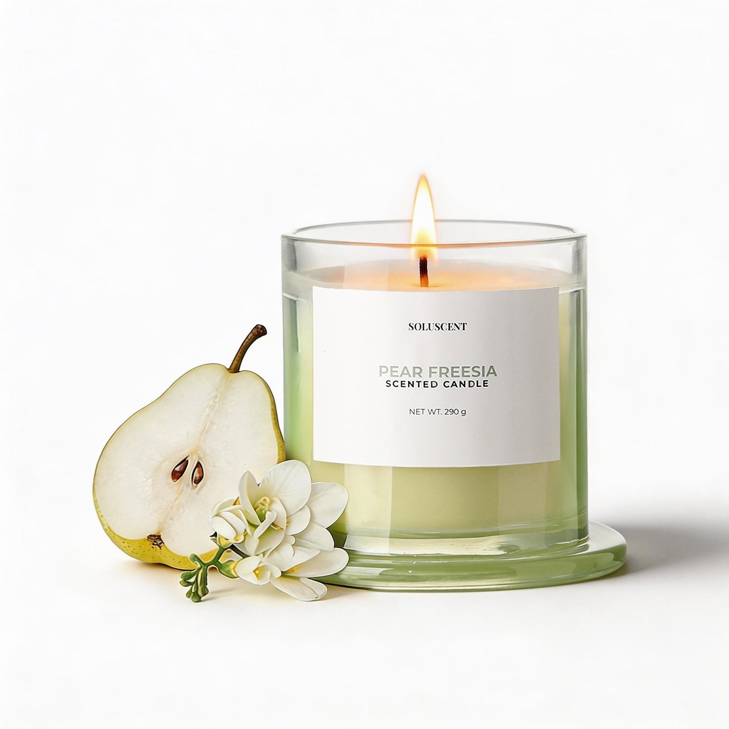 Soluscent Pear Freesia candle styled with pear and freesia flowers