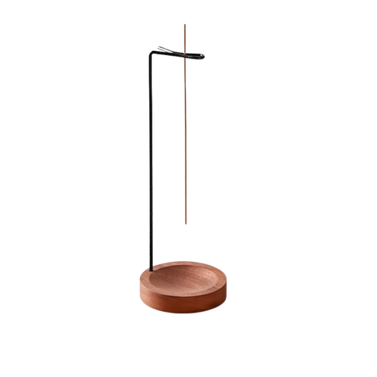 Wooden incense holder with a single incense stick on a white background