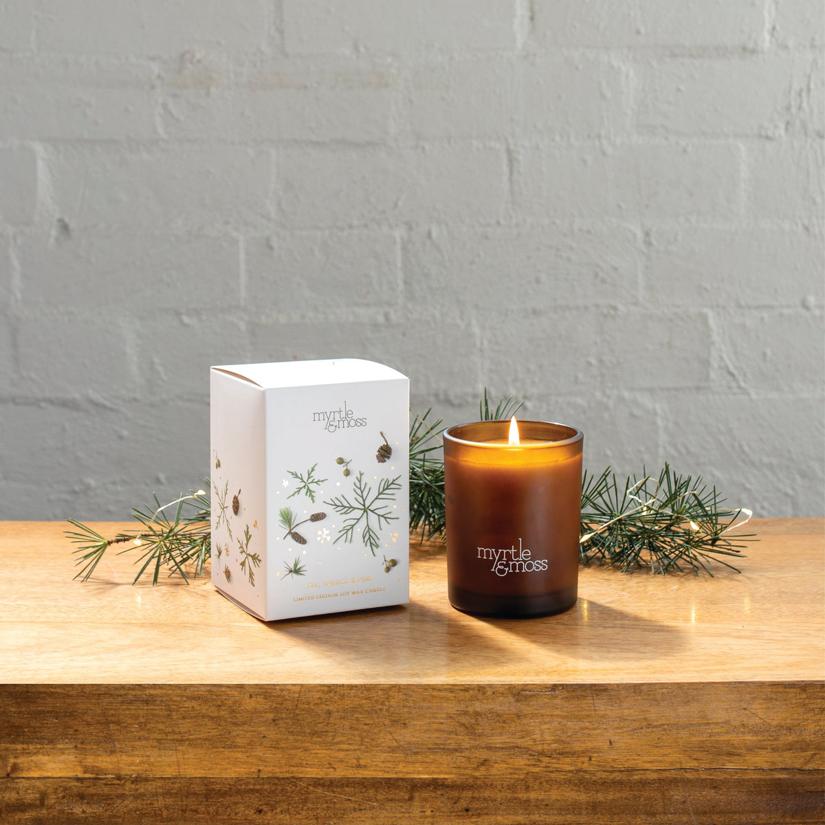 Myrtle & Moss Christmas Candle Fir, Pine & Spruce 50 Hours - product and Christmas packaging
