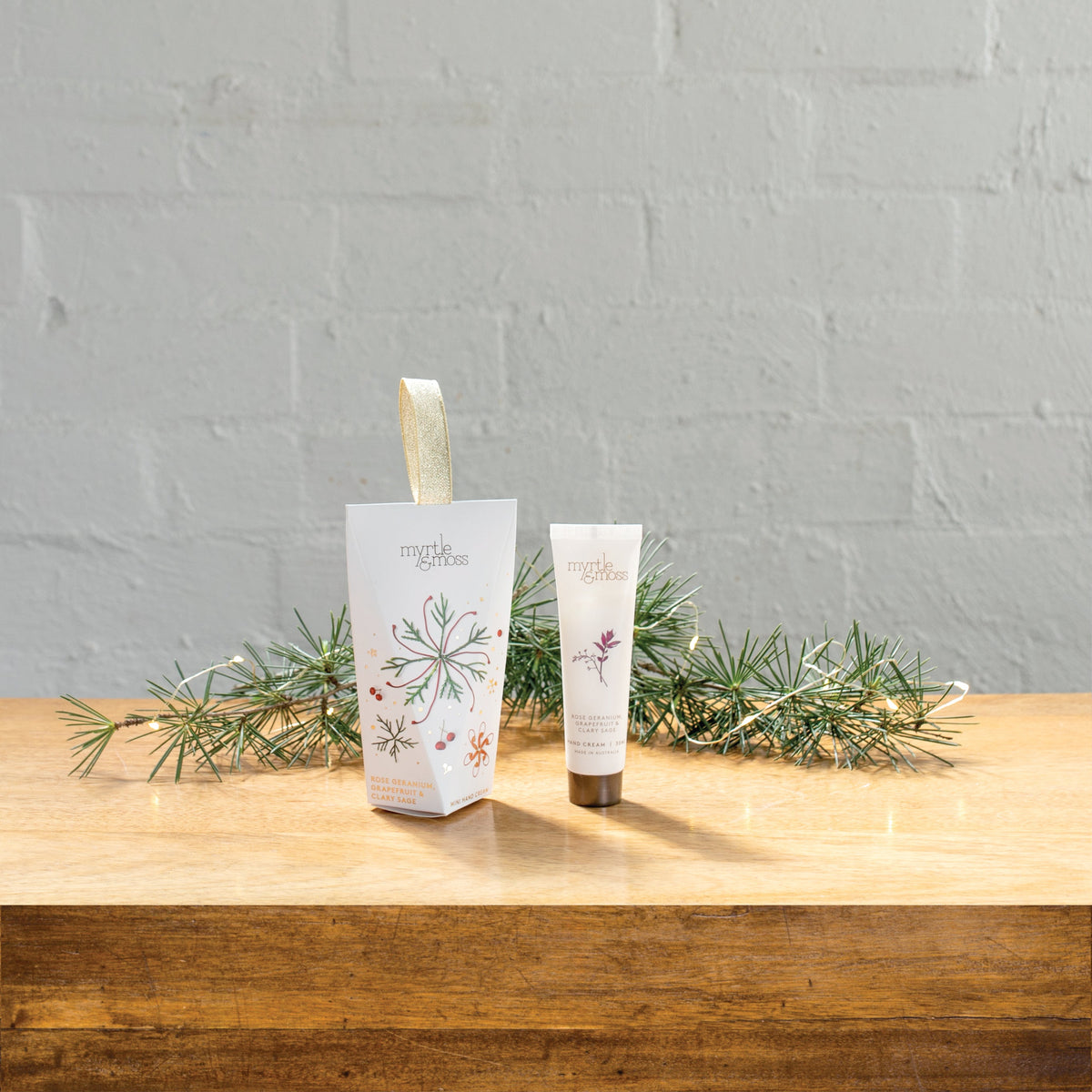 Myrtle & Moss Christmas Hand Cream Ornament Rose Geranium, Grapefruit & Clary Sage 30mL - product and Christmas packaging