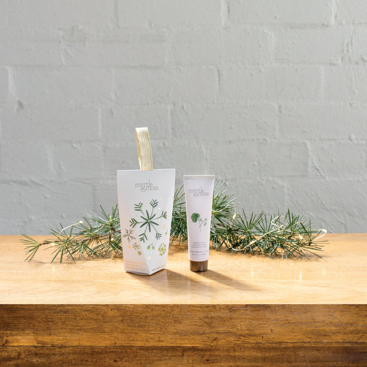 Myrtle & Moss Christmas Hand Cream Ornament Bergamot Rind, Tangerine & Geranium Leaf 30mL - product and Christmas packaging