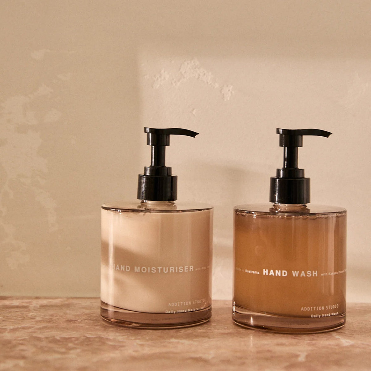 Addition Studio Hand Wash and Hand Moisturiser 390mL gift set in a warm styled bathroom