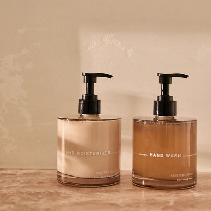 Addition Studio Hand Wash and Hand Moisturiser 390mL gift set in a warm styled bathroom