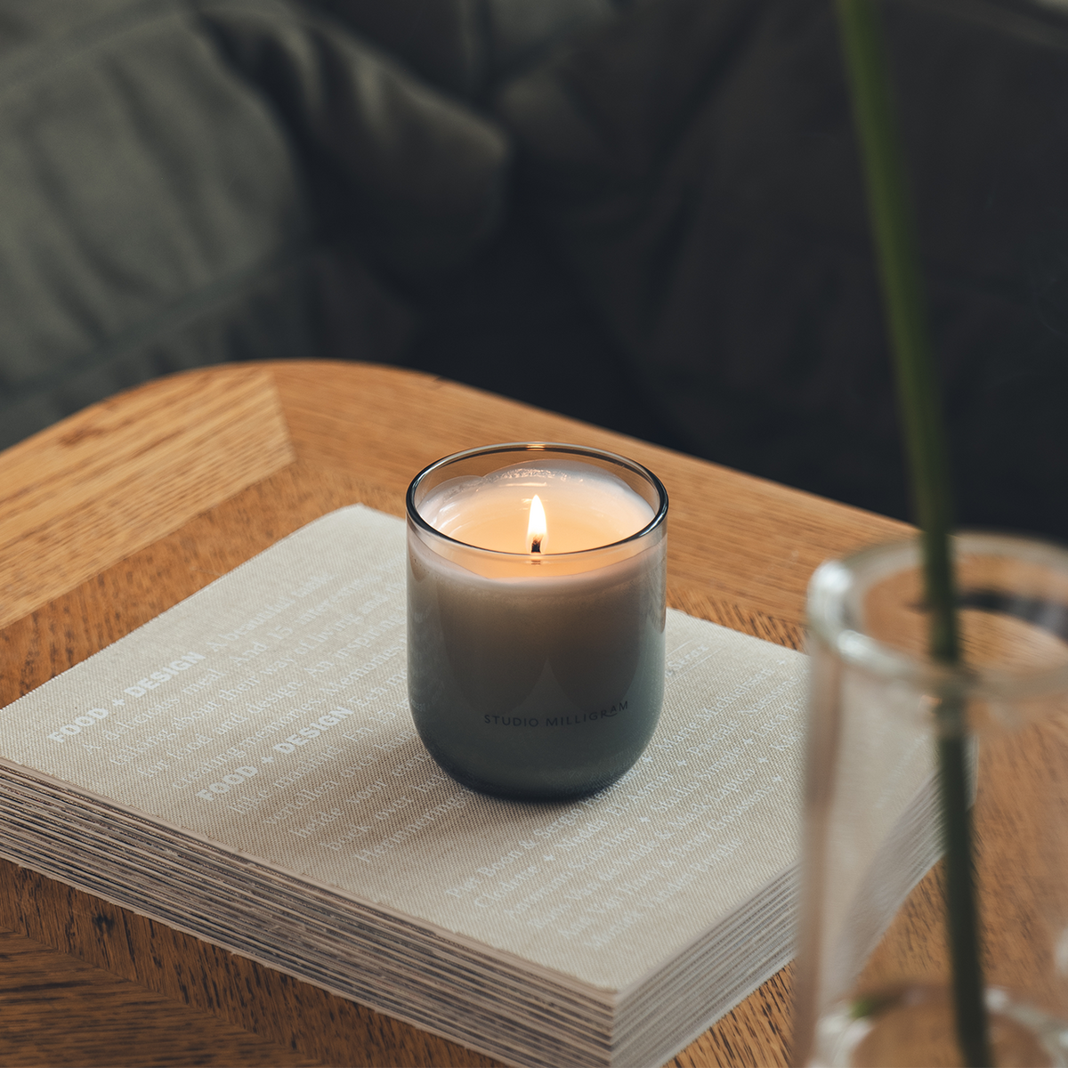 Studio Milligram Study of Trees candle lit on timber table in warm home