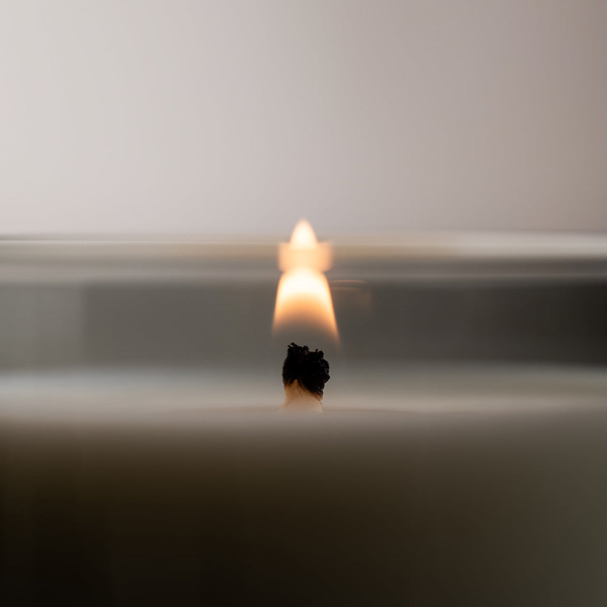 Studio Milligram Ultra Violet Scented Candle 220g lit wick detail